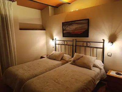 a bedroom with two beds in a room at La Artesana in Posada de Rengos