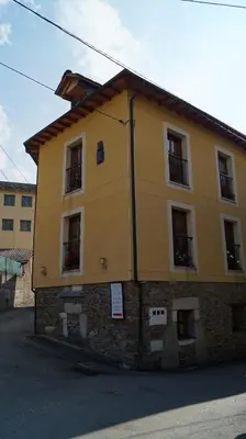 a yellow building on the side of a street at La Artesana in Posada de Rengos