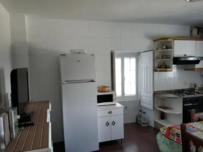 a kitchen with a white refrigerator and a stove at PRECIOSA CASA DE 4 HABITACIONES EN PLENO CORAZÓN DEL CAMINO DE SANTIAGO! in Palas de Rei