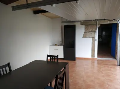 a kitchen and dining room with a table and chairs at PRECIOSA CASA DE 4 HABITACIONES EN PLENO CORAZÓN DEL CAMINO DE SANTIAGO! in Palas de Rei