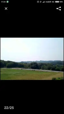 a picture of a plane flying over a field at PRECIOSA CASA DE 4 HABITACIONES EN PLENO CORAZÓN DEL CAMINO DE SANTIAGO! in Palas de Rei