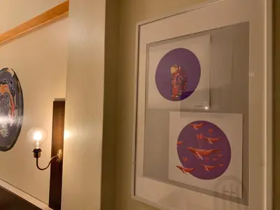 a hallway with two pictures on the wall at Hotel Brial in Perillo