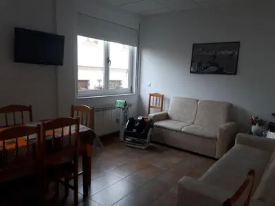 a living room with a couch and a table at Ultreia in Portomarin