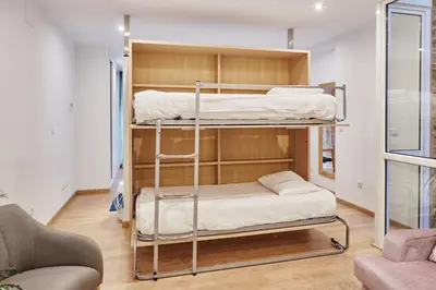 a couple of bunk beds in a room at Apartamentos Orfas in Santiago de Compostela