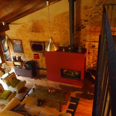 an overhead view of a living room with a fireplace at CASA CASTAÑÉ in Puente de Domingo Flórez