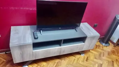 a entertainment center with a television on top of it at Piso Ourense Bonito y Termal in Ourense