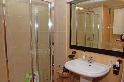 a bathroom with a sink and a shower at Piso Ourense Bonito y Termal in Ourense