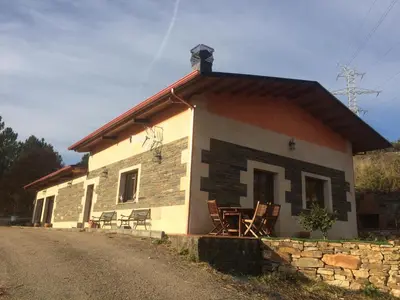 a small house with chairs sitting outside of it at Luxury Valdeorras in Valdegodos