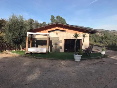 a small house with a bed in front of it at Luxury Valdeorras in Valdegodos