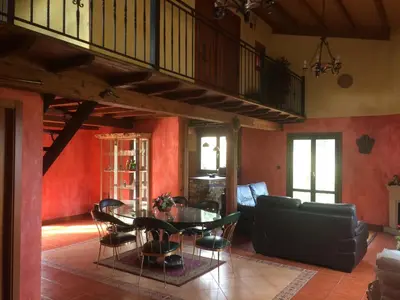 a living room with a table and chairs at Luxury Valdeorras in Valdegodos