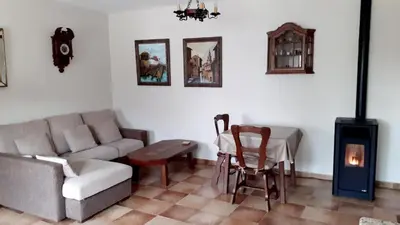 a living room with a couch and a table at Stone Cottage FINISTERRE in Curtis