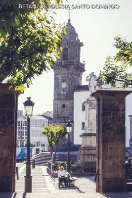 a building with a clock tower in the background at Stone Cottage FINISTERRE in Curtis