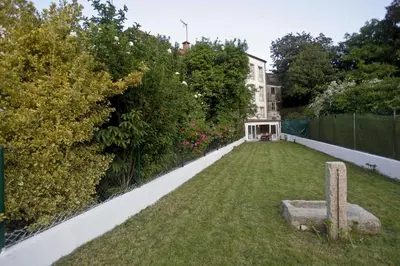 a garden in front of a building at Catedral Site by Como en Casa in Santiago de Compostela