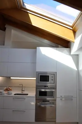a kitchen with a stove and a window at Catedral Site by Como en Casa in Santiago de Compostela
