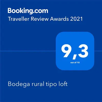 a screenshot of a phone with a travelivanivan rewards symbol at Bodega rural tipo loft in Ourense