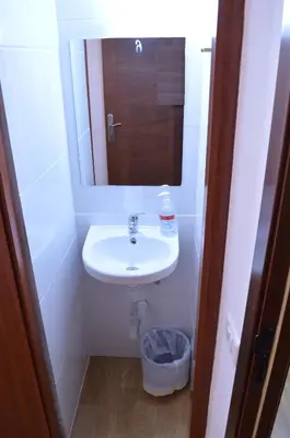 a bathroom with a sink and a mirror at ArArAt Hostel in Santiago de Compostela