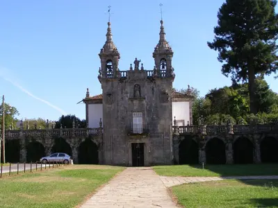 an old building with two towers on top of it at Hotel Restaurante America in Oca