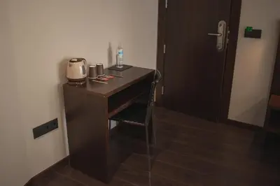 a room with a desk with a coffee maker on it at Pensión A Casa do Peregrino in Santiago de Compostela