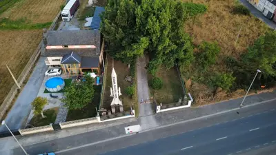 an image of a swimming pool in a yard at Hotel Rural Camino Medulas in Ponferrada