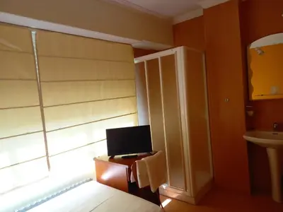 a room with a computer on a desk with a window at Pension San Roque in Lugo
