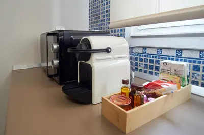 a refrigerator in a kitchen with a tray of food at Apartamentos Los Arroyos in Ponferrada
