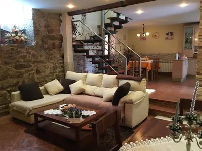 a living room with a couch and a table at O Lar de Sara in Pontevedra