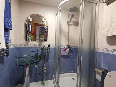 a bathroom with a shower and a glass sink at O Lar de Sara in Pontevedra