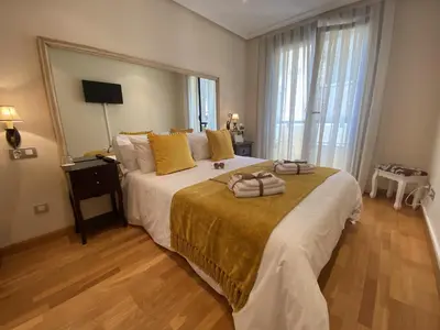 a small room with a bed in a room at Clarens Guesthouse in Cangas del Narcea