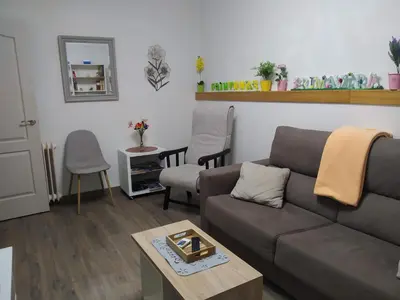 a living room with a couch and a table at Apartamento Casco Antiguo Ponferrada in Ponferrada