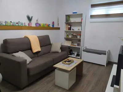 a living room with a couch and a coffee table at Apartamento Casco Antiguo Ponferrada in Ponferrada