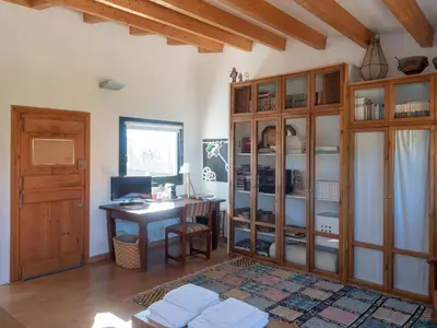 a home office with a desk and a computer at Casa Lourido in Sada