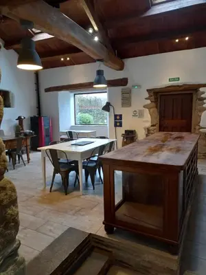 a dining room with a table and some chairs at Albergue o Xistral in Abadín