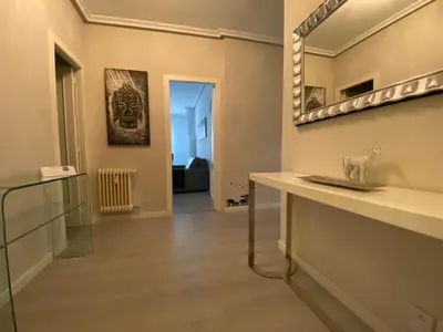a bathroom with a mirror on the wall and a sink at Ourense Termal in Ourense