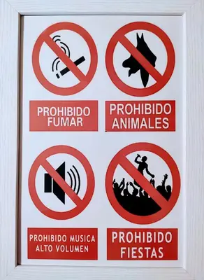 a group of prohibitory signs on a wall at Apartamento DACTONIUM - Ribeira Sacra in Monforte de Lemos