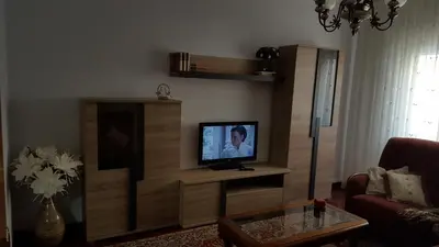a living room with a tv on a wall at La Casita de Plata in Monforte de Lemos