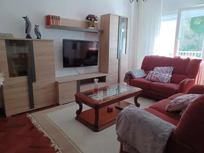 a living room with a couch and a tv at La Casita de Plata in Monforte de Lemos