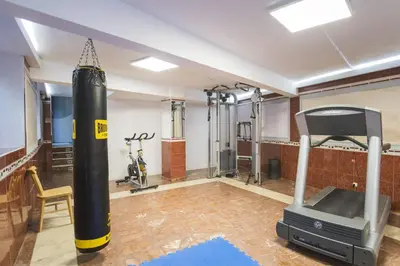 a gym with a punching bag and a treadmill at Hotel Alda Centro Ponferrada in Ponferrada