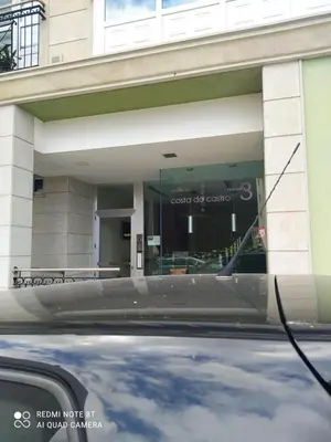 a car parked in front of a building at Costa do Castro in Foz