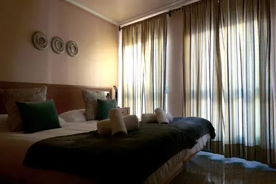 a bedroom with a bed with two teddy bears on it at H. O Lar in O Barco de Valdeorras