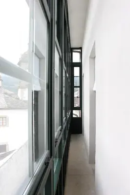 a hallway of a building with a window at Casa Pedrosa in Mondoñedo