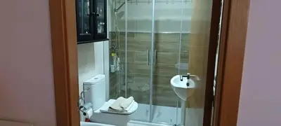a bathroom with a shower and a toilet and a sink at Cozy apartment in Orense of 45 m² with parking in Ourense