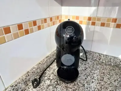 a black electric hair dryer sitting on a counter at Cozy apartment in Orense of 45 m² with parking in Ourense