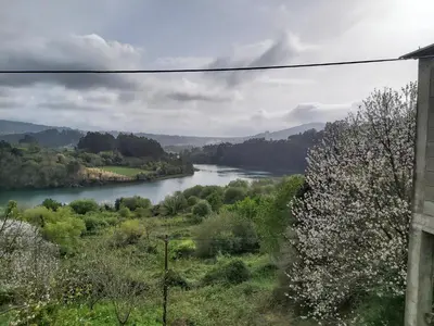 a view of a river from a house at Apartamentos Rosa Jove in Cabañas