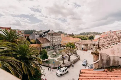 a view of a city with cars parked in a street at Apartamento La Iglesia in Caldas de Reis
