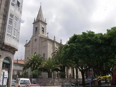 an old building with a clock tower on top of it at Apartamento La Iglesia in Caldas de Reis