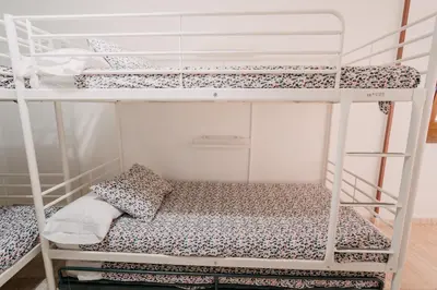 a couple of bunk beds in a room at Apartamento La Iglesia in Caldas de Reis