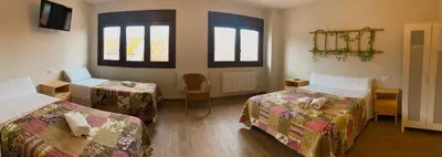 a room with two beds with stuffed animals on them at Villa Galicia in Caldas de Reis