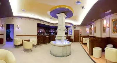 a bar with a fountain in the middle of a room at Pensión Bos in Bergondo