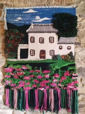 a painting of a house with flowers on a wall at Casa Rubal in Foz