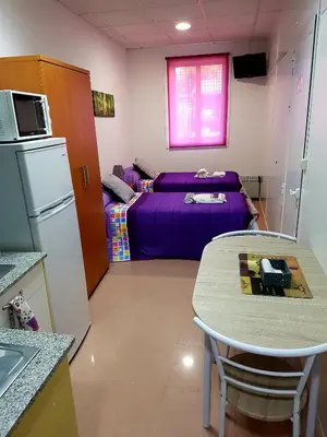 a small room with a table and a bed at Apartamento Study 1 Select Real Caldas de Reis in Caldas de Reis